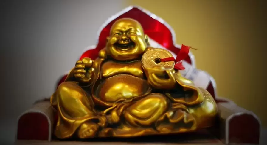 Laughing Buddha with good luck charm